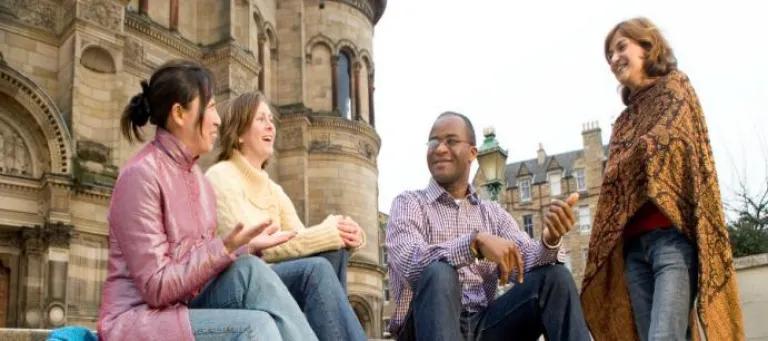 Group of people talking outside McEwan Hall, University of Edinburgh 