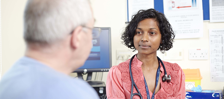 a patient speaks with a clinician at the Anne Rowling Clinic